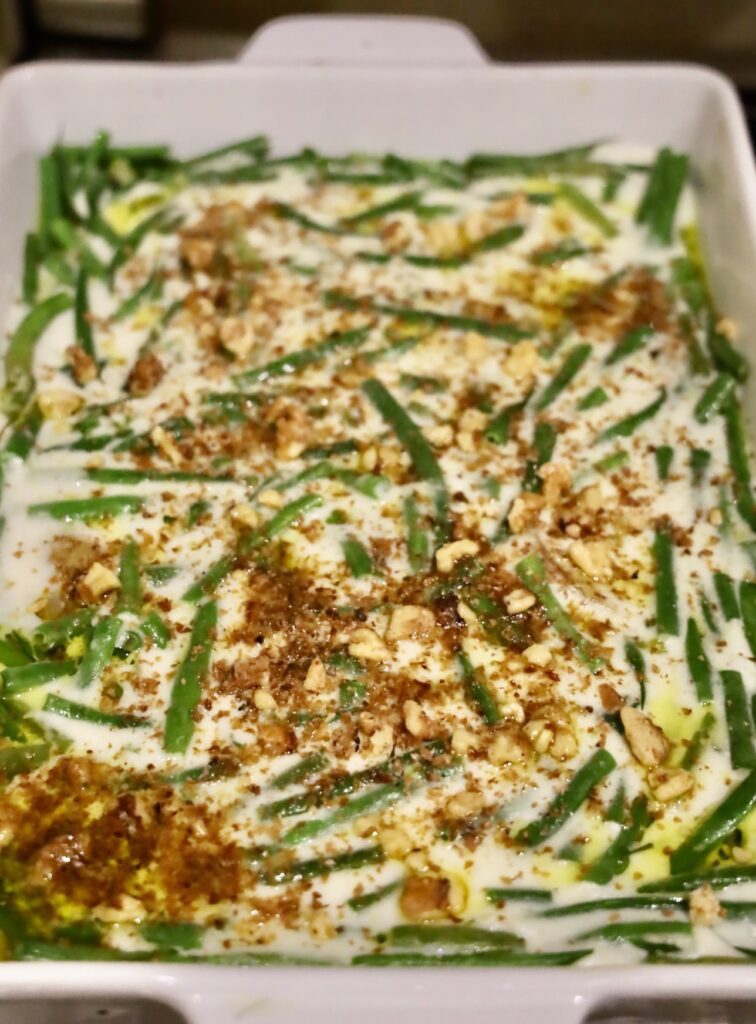 Dairy Free Green Bean Potato Casserole

	Prep Time: 1 hour
	Cook Time: 50 minutes

_ This is far from your typical Durkee Green Bean Casserole; it's a unique, soup-free green bean casserole. A friend once remarked, “Why would anyone opt for the traditional Durkee green bean casserole, a standard in American cuisine, when they could have this? This is the best thing I've ever eaten.”_ 

The classic Durkee green bean casserole, while a staple of many tables, is laden with preservatives from canned mushroom soup, saturated in sodium, and carries unhealthy fats courtesy of the fried onions. Its nutritional value is minimal, leaving much to be desired, especially in an era where access to high-quality foods has significantly improved, diminishing its appeal to many.

Conversely, a homemade version of this casserole elevates the dish to new heights of health and flavor. Utilizing goat's milk for its better digestibility or coconut milk for a dairy-free alternative, this casserole marries the nutritional benefits with gourmet taste. It boasts organic French green beans known for their tender texture, vibrant, life-enhancing mushrooms and shallots, and a rich, scratch-made béchamel sauce that replaces the canned soup. The addition of organic potatoes not only infuses the dish with more substance but also introduces a universally beloved element. This homemade green bean casserole is so delightful, it stands proudly as a standalone dish, ready to impress guests with its depth of flavor and wholesome ingredients. Incorporating potatoes not only adds heartiness but ensures its place as a crowd-pleaser.

_Make this recipe with coconut oil and coconut milk to be a dairy free green bean casserole. Of course, once you remove the dairy, this becomes a vegan bean casserole_