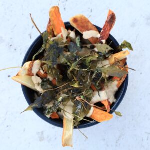 sweet potato fries covered with nacho sauce and deep fried greens