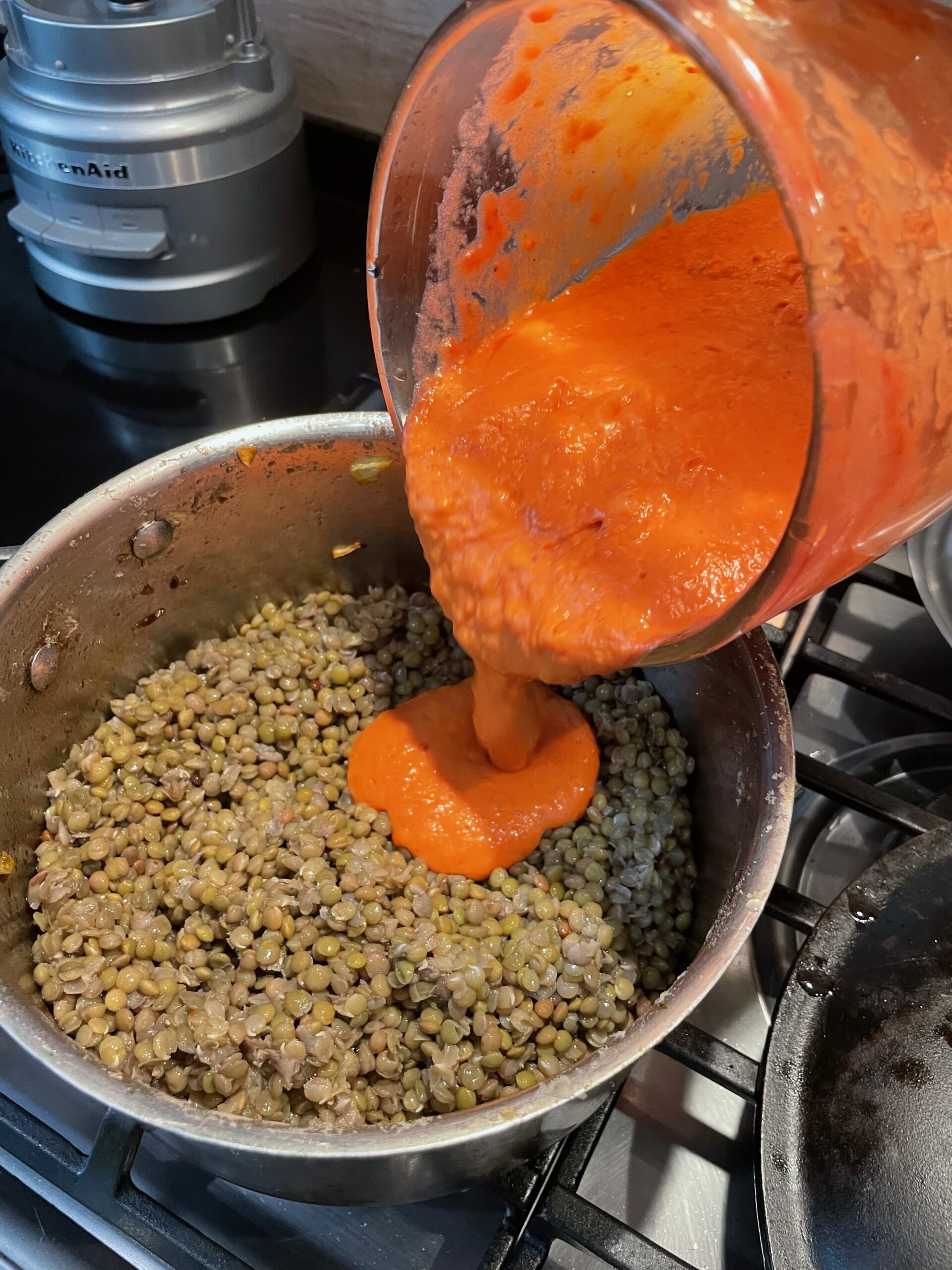 tomato mixture being poured into the pan