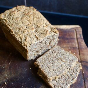 Chia Bread sliced on a wooden cutting board